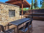 Common Area Deck with hot tub, grills, seating and tables, and 2 fire features